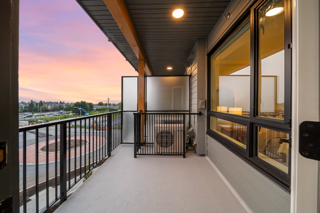 Private balcony at The Commons condos in Willoughby, Langley, looking over the street at dusk