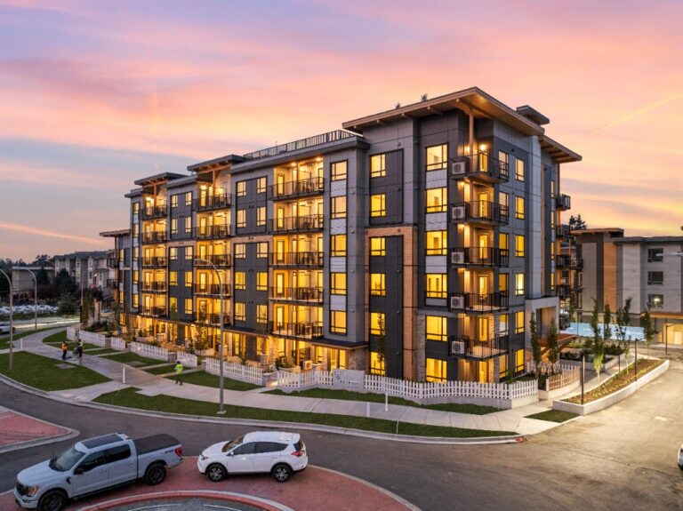 The Commons condominiums in Willoughby, Langley, photographed at dusk with warm interior lights