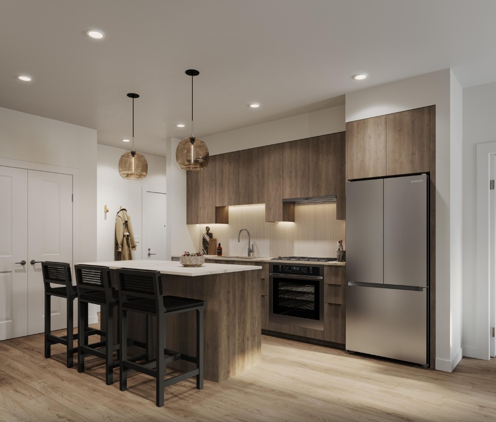 Kitchen with a five-burner gas cooktop and full-size appliances in the condos at Atlin and Bute at Clayton Crest, West Clayton, Surrey